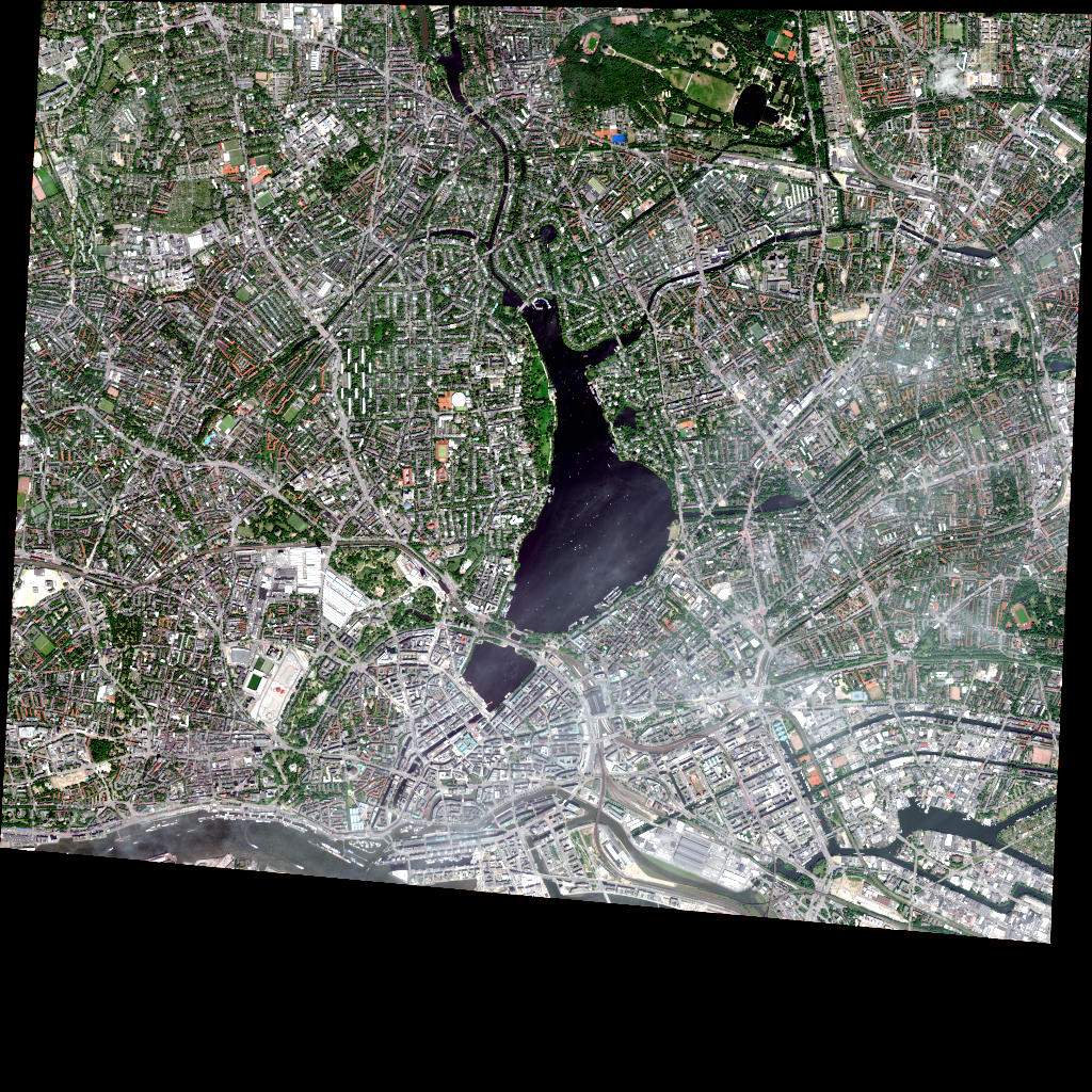 Sentinel-2 satellite image of a European city showing an urban area surrounding a central lake and harbour
